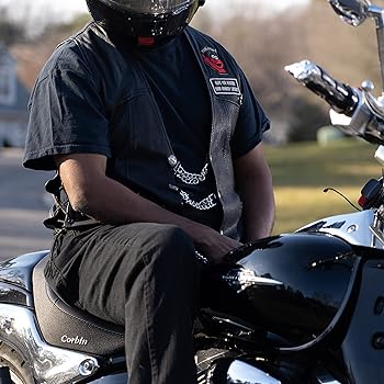 biker wearing a vest with patches and vest extenders